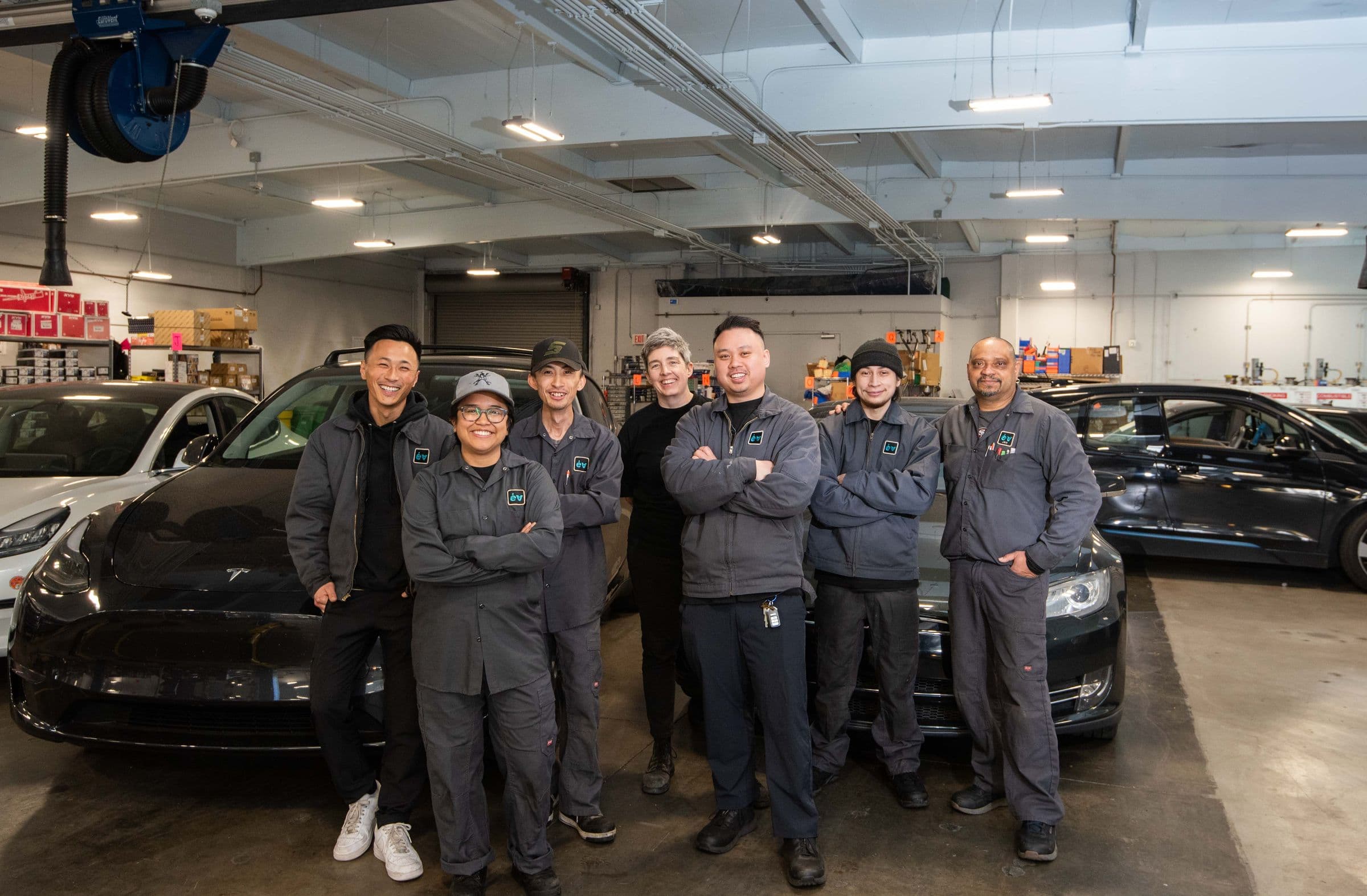 The Earthling technicians lined up in front of the Teslas in the bays, arms folded